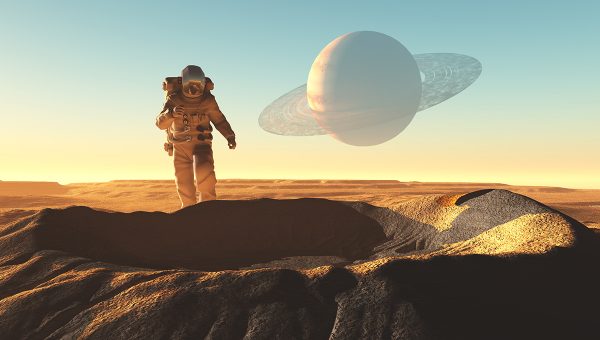 Astronaut objavuje kráter na neznámej planéte. Zdroj: iStockphoto.com