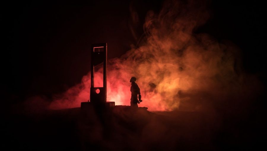 Muž pred gilotínou. Zdroj: iStock/Zeferli