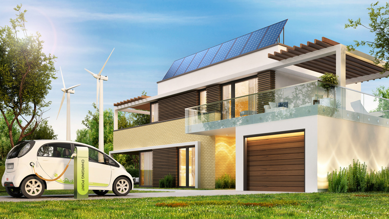 Ilustračné foto: Dom so solárnymi panelmi, veternými turbínami a electrickým autom. Zdroj: Istockphoto.com